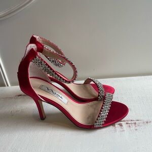 Red heels with sparkly diamond detail.